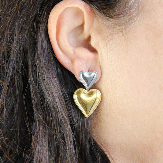 Two-color heart dangle drop earrings in gold and silver, featuring a stylish and modern design. Lightweight and elegant drop earrings, perfect for everyday wear or special occasions. Trendy perfect gift for women and girls who love unique jewelry.
