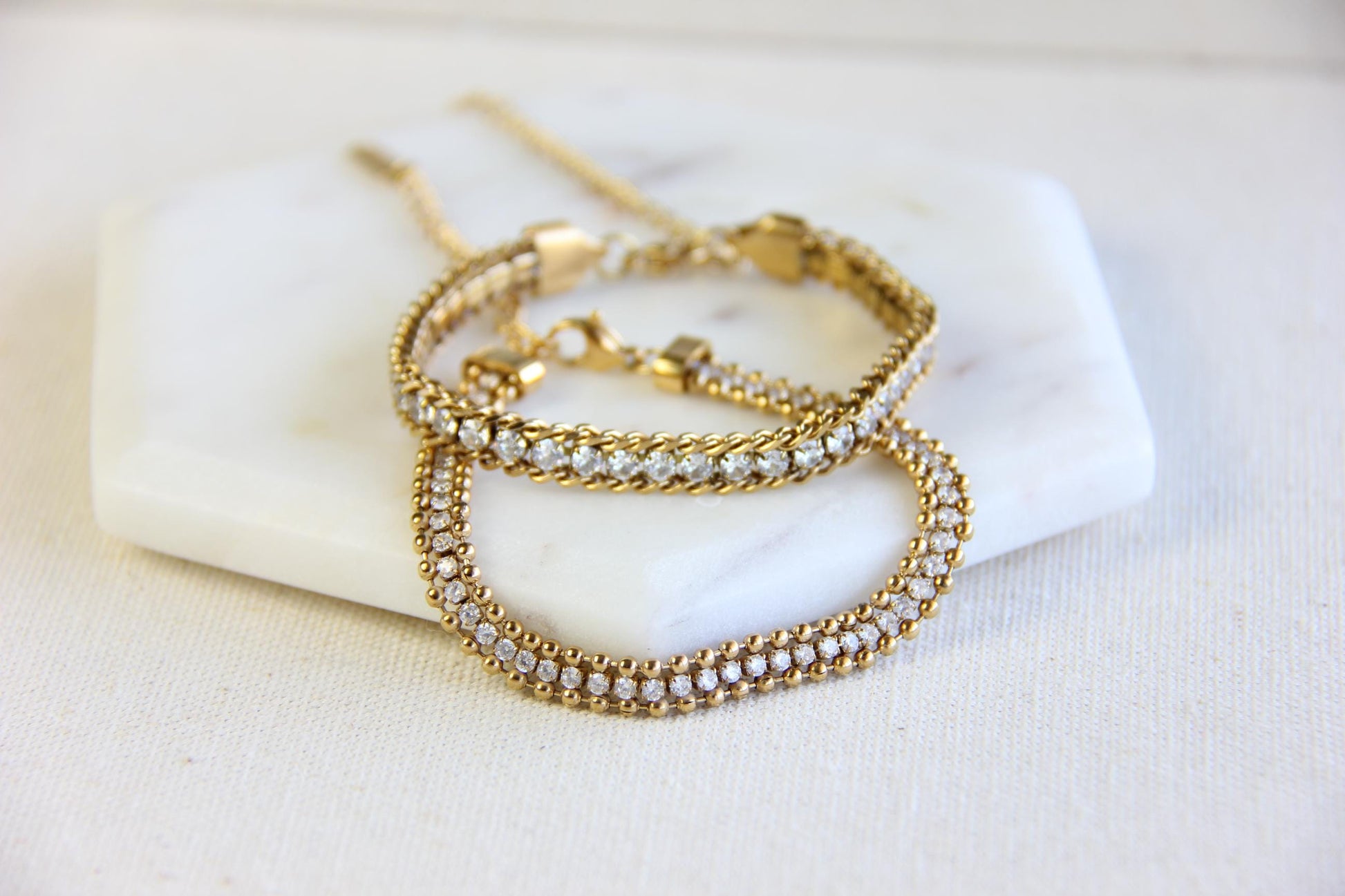 Beautiful zirconia woven gold bracelet with a touch of sparkle. Its delicate design and shimmering stones make it perfect for any outfit. Great for everyday wear, special occasions, or as a lovely gift for her.