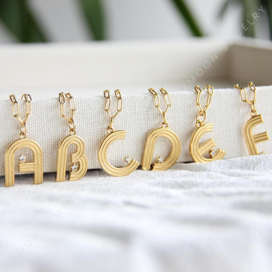 Gold initial letter necklace with a dainty pendant, perfect for personalized jewelry lovers. Elegant and minimalist custom letter necklace for everyday wear or layering. Custom letter charm necklace, a thoughtful gift for friends, bridesmaids or mom.