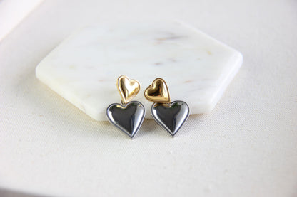 Two-color heart dangle drop earrings in gold and silver, featuring a stylish and modern design. Lightweight and elegant drop earrings, perfect for everyday wear or special occasions. Trendy perfect gift for women and girls who love unique jewelry.