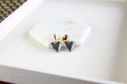 Two-color heart dangle drop earrings in gold and silver, featuring a stylish and modern design. Lightweight and elegant drop earrings, perfect for everyday wear or special occasions. Trendy perfect gift for women and girls who love unique jewelry.