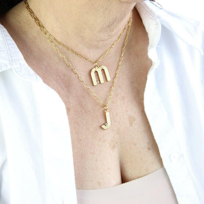 Gold initial letter necklace with a dainty pendant, perfect for personalized jewelry lovers. Elegant and minimalist custom letter necklace for everyday wear or layering. Custom letter charm necklace, a thoughtful gift for friends, bridesmaids or mom.