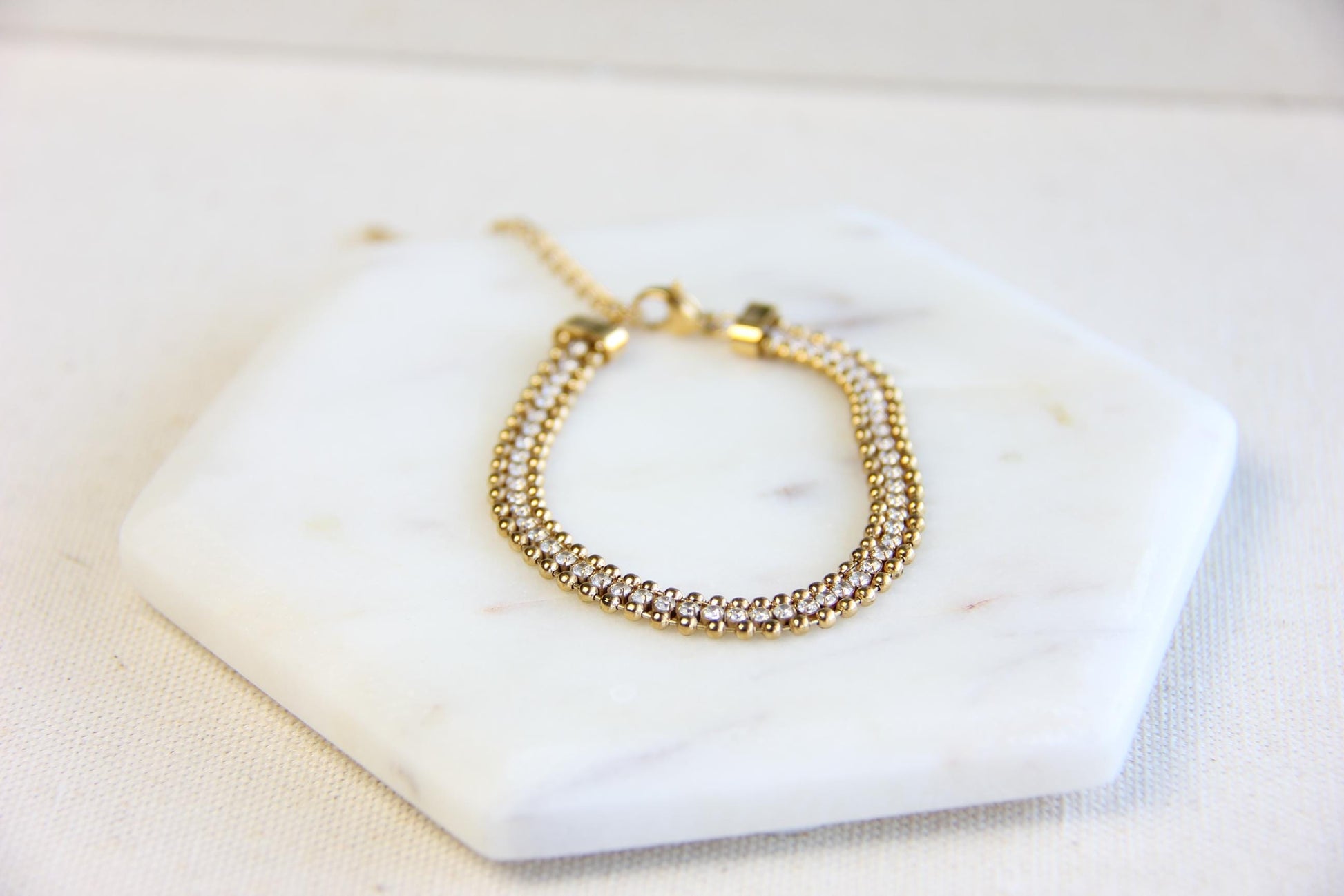 Beautiful zirconia woven gold bracelet with a touch of sparkle. Its delicate design and shimmering stones make it perfect for any outfit. Great for everyday wear, special occasions, or as a lovely gift for her.