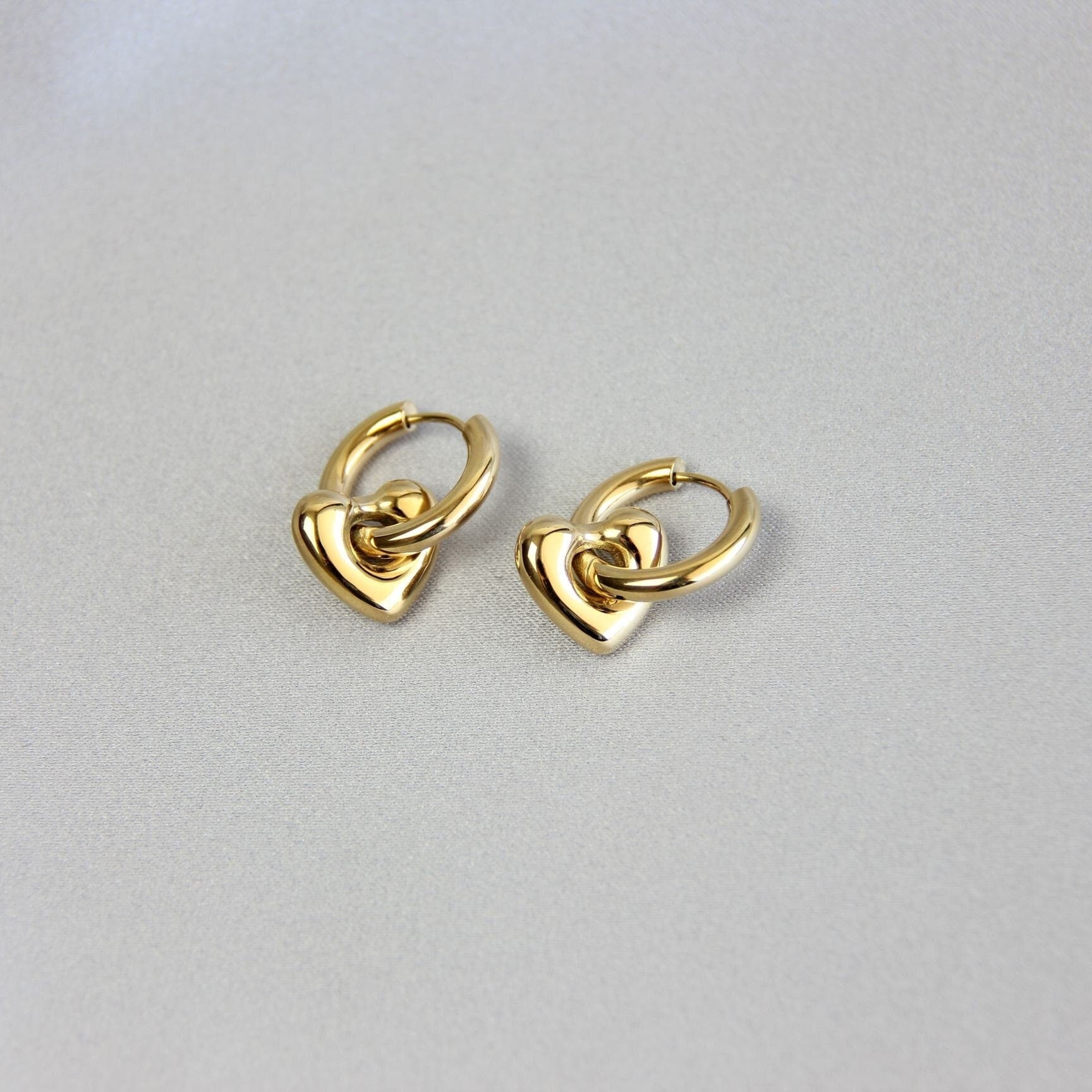 Star, Moon and Heart Pendant Gold Huggie Earrings. Mix and Match 18K gold hoop celestial earrings. Perfect gift for your loved ones.