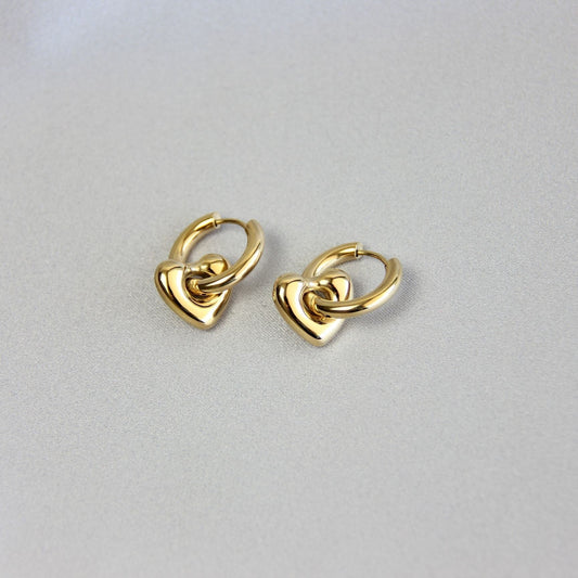 Star, Moon and Heart Pendant Gold Huggie Earrings. Mix and Match 18K gold hoop celestial earrings. Perfect gift for your loved ones.