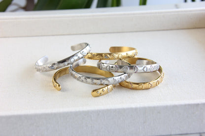 Unique 18K Gold Plated Open Cuff Bangle Bracelet with colorful cubic zirconia stars that reflects both minimalist and statement textures. Complete your special occasion outfit or night style with this beauty!